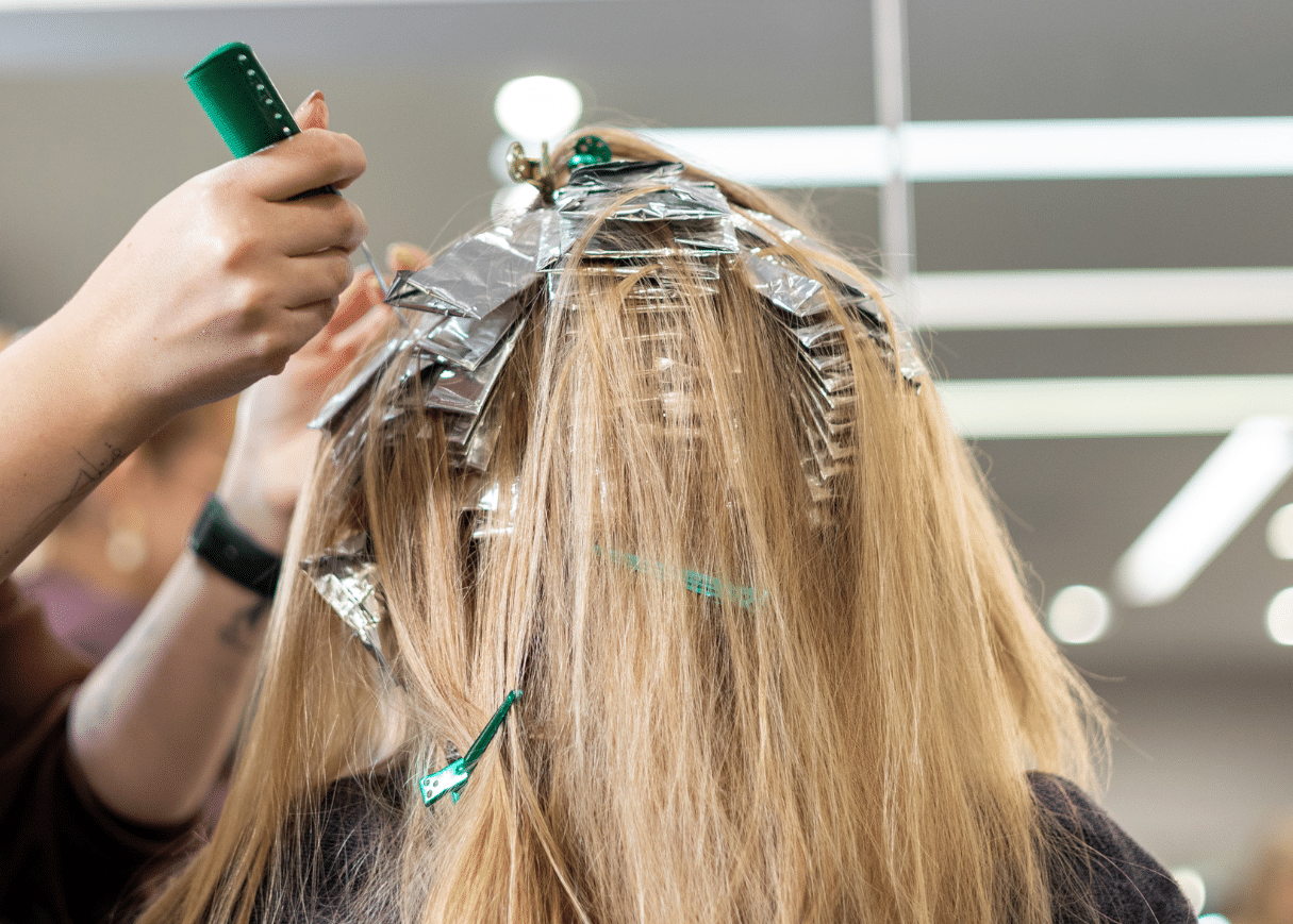 Hair being highlighted with foils