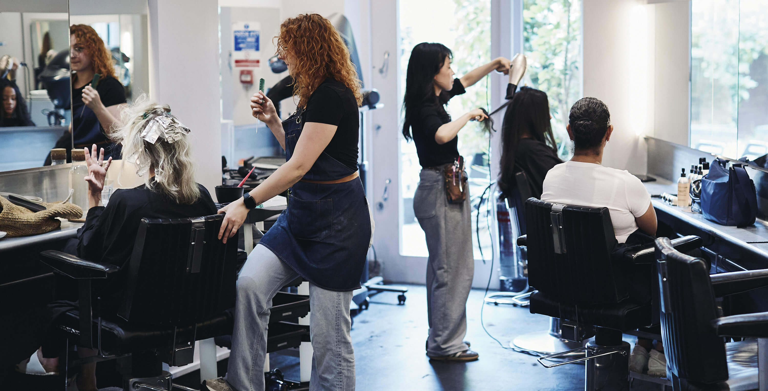 Stylists at work inside the salon at Windle London 